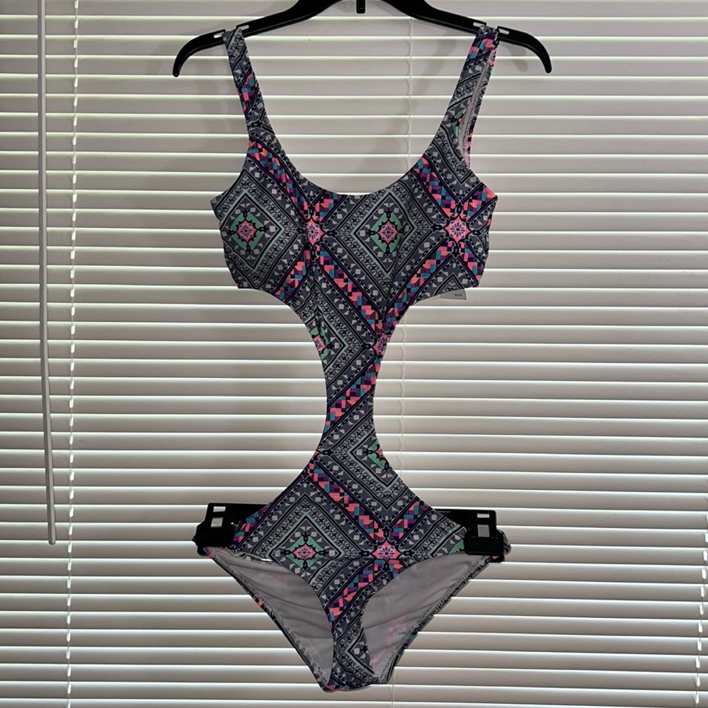 Cute One Piece Multicolored swimsuit.  New with tag.  Size S
